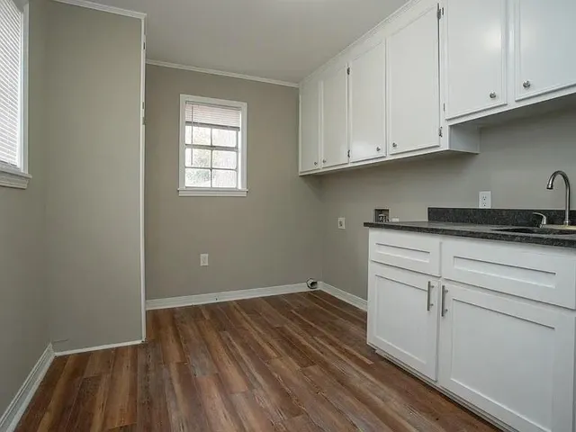 a view of cabinets and wooden floor
