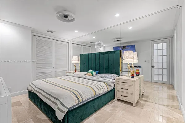 a kitchen with a refrigerator a sink and a stove top oven