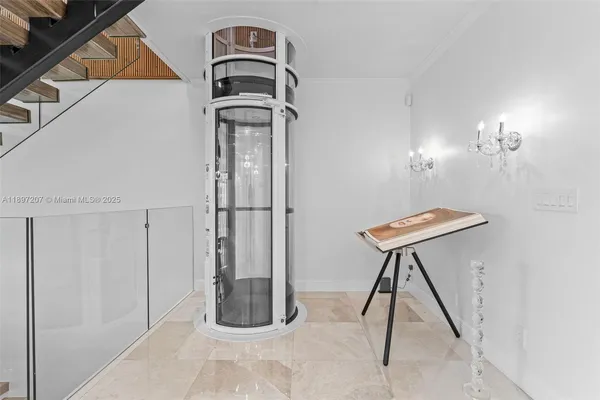 a kitchen with stainless steel appliances a large window a sink and a refrigerator