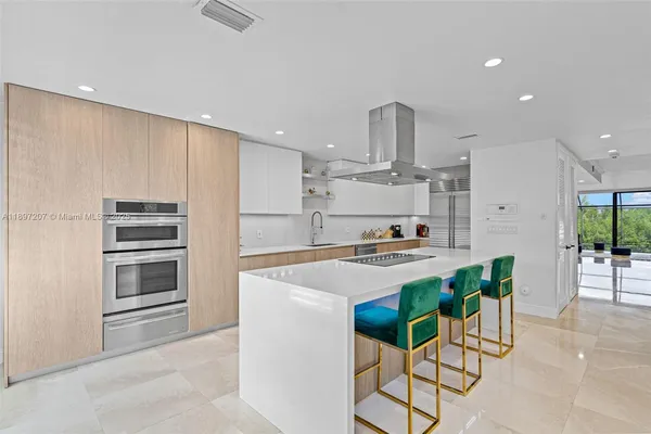 a view of kitchen with windows and ceiling fan