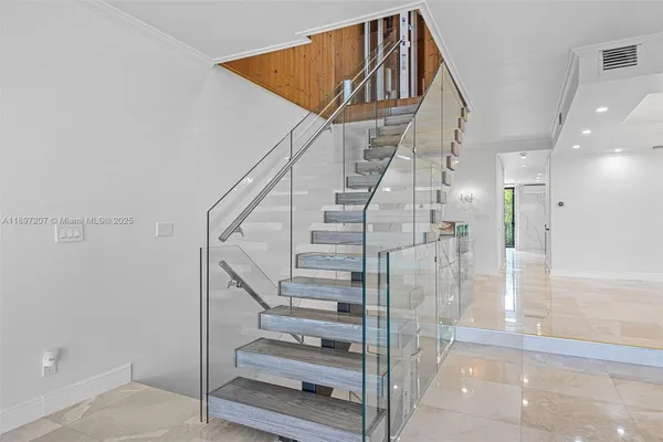 a bathroom with a tub sink shower and mirror