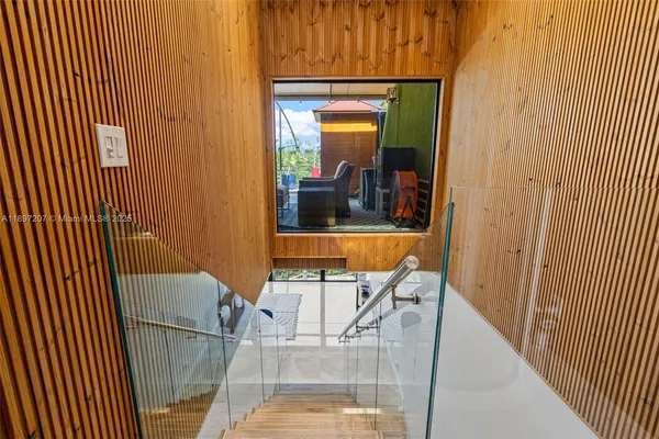 a bathroom with a bathtub sink and mirror