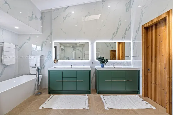 a view of a house with a swimming pool and sitting area