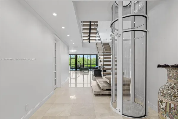 a living room with furniture and white walls