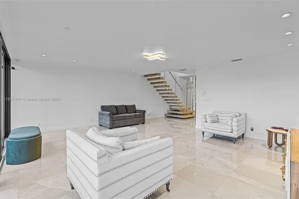 a view of a chairs on the roof deck