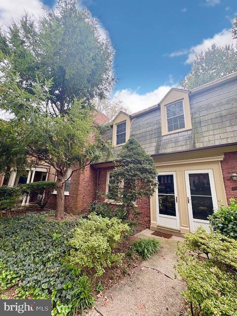 1303 South Barton Street, Unit 204 Arlington, VA 22204 - Photo 2 of 18 front view of a house with a yard