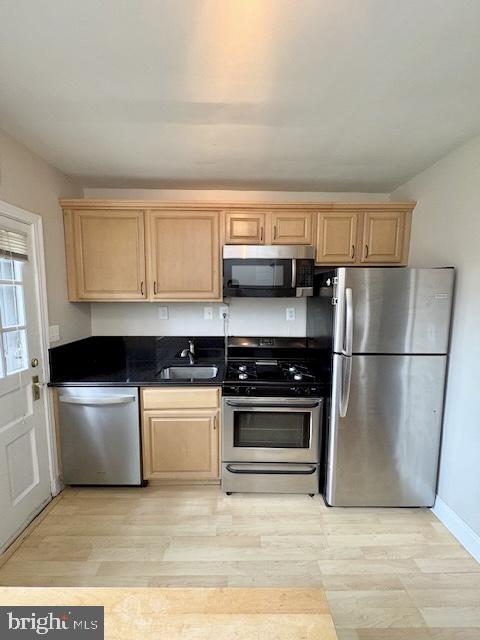 1303 South Barton Street, Unit 204 Arlington, VA 22204 - Photo 7 of 18 a kitchen with a stove a microwave and a refrigerator