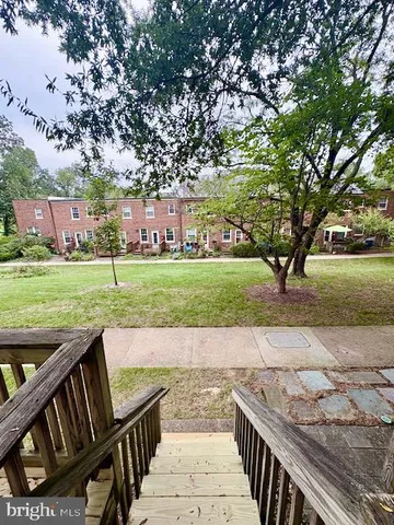 a view of a patio with a yard