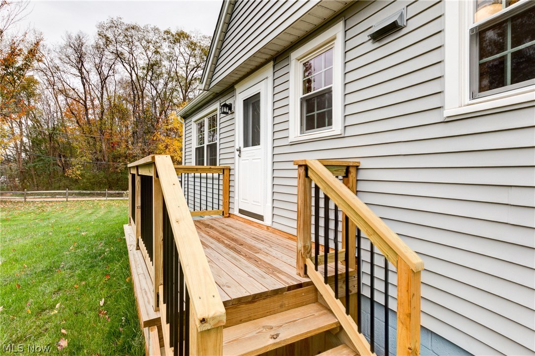 38705 Chardon Road Willoughby Hills, OH 44094 - Photo 31 of 35 Wood Deck with black accent spindles - vinyl siding - vinyl clad windows - new front doors - new roof - nicely landscaped lot with access onto a great side street Graylock....