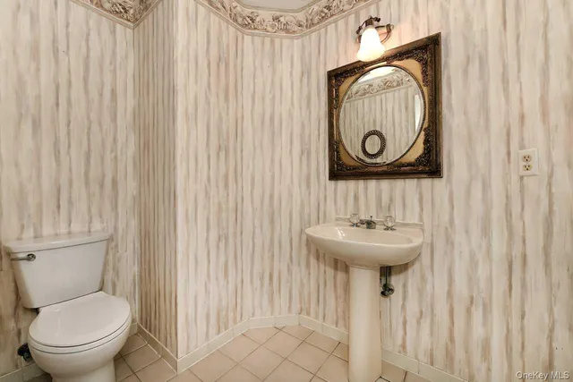 a bathroom with a toilet and a sink