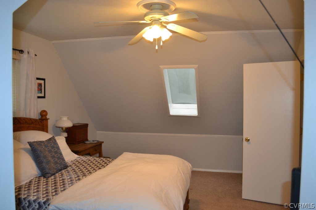 5413 Rollingway Road Chesterfield, VA 23832 - Photo 6 of 19 a bedroom with a bed and a chandelier