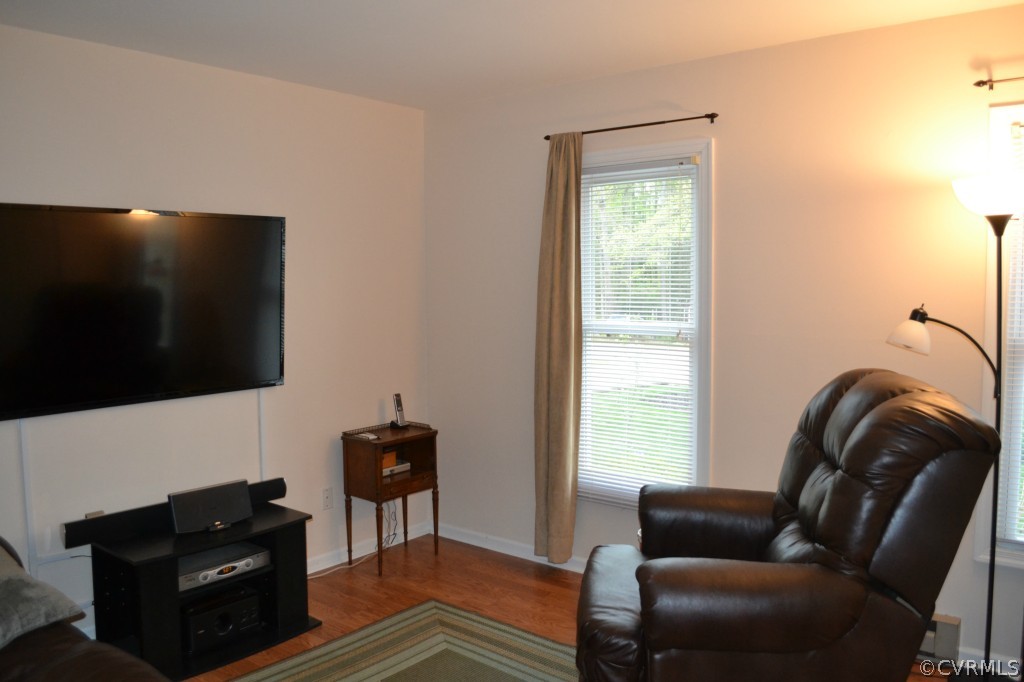 5413 Rollingway Road Chesterfield, VA 23832 - Photo 9 of 19 a living room with furniture and a flat screen tv