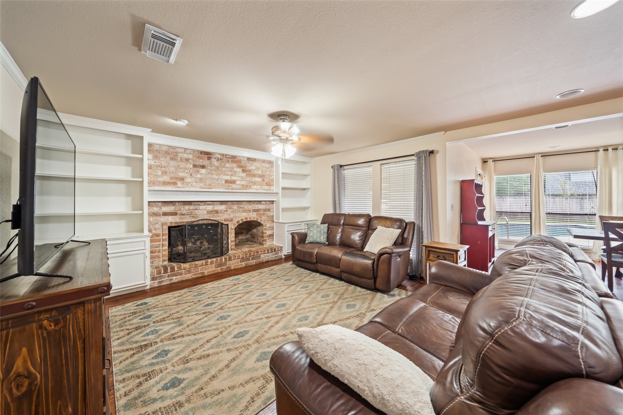 600 Hampton Hall Lane Conroe, TX 77302 - Photo 14 of 32 a living room with furniture and a fireplace