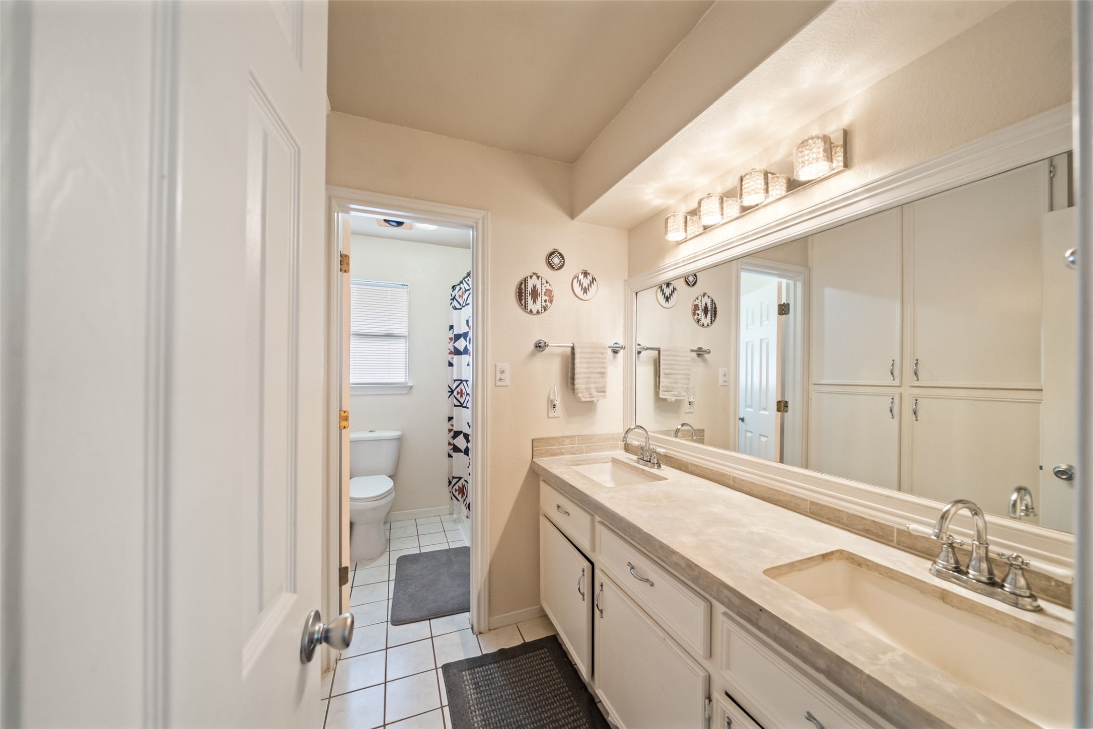 600 Hampton Hall Lane Conroe, TX 77302 - Photo 27 of 32 a spacious bathroom with a double vanity sink a mirror and a shower