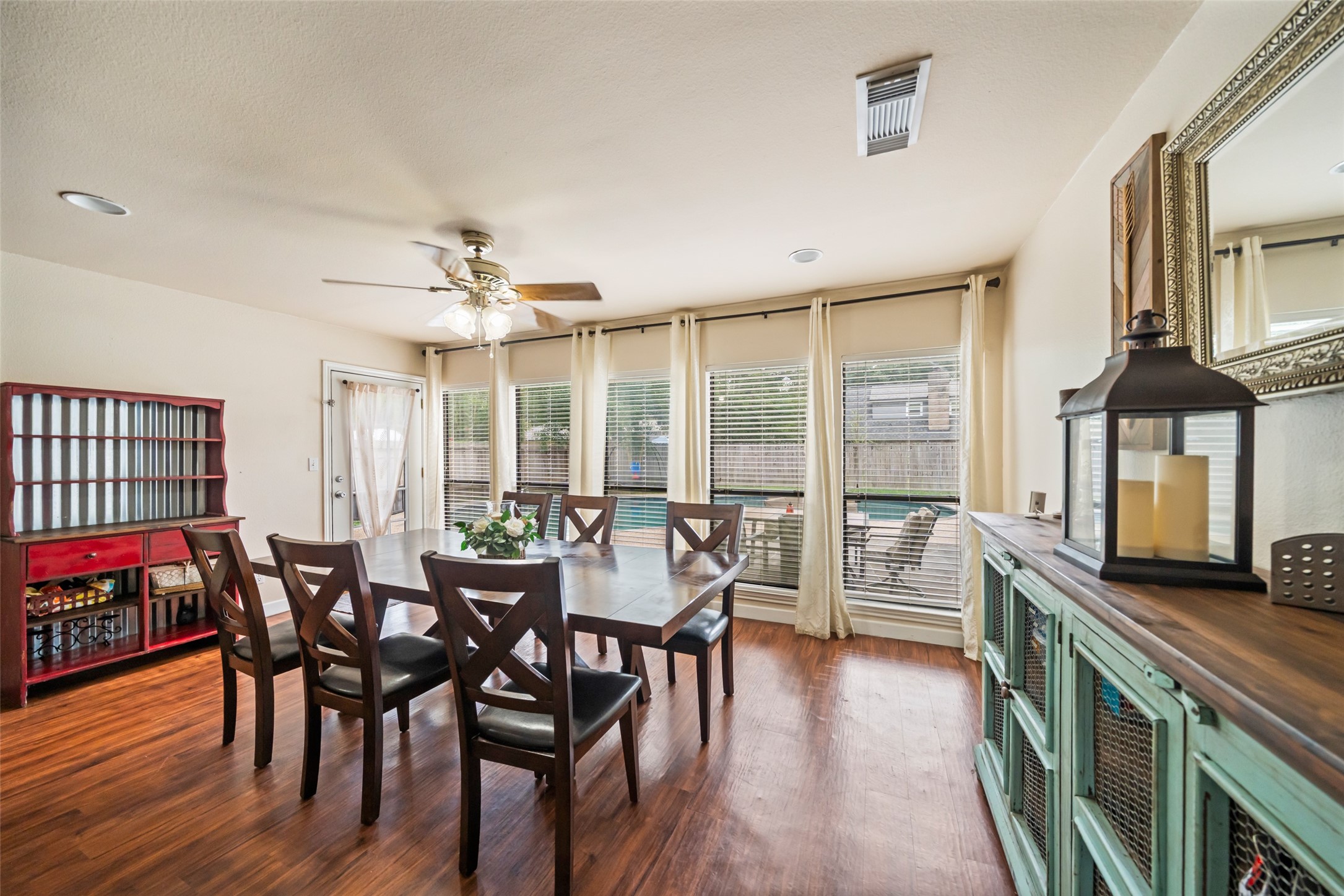 600 Hampton Hall Lane Conroe, TX 77302 - Photo 7 of 32 a view of a dining room with furniture window and wooden floor