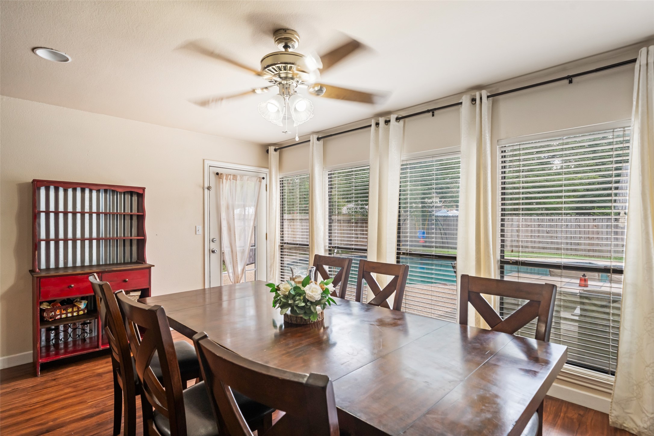 600 Hampton Hall Lane Conroe, TX 77302 - Photo 8 of 32 a view of a dining room with furniture window and wooden floor