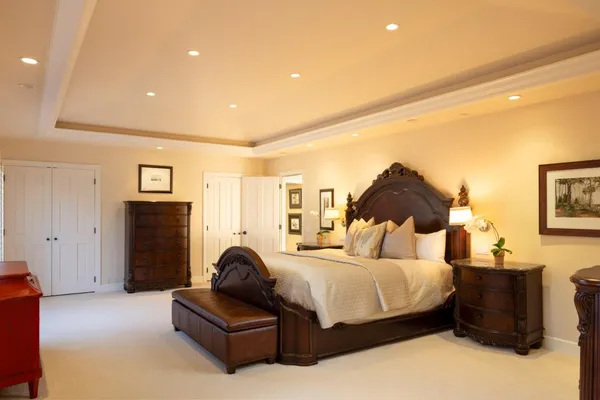 a bedroom with a bed and a couch