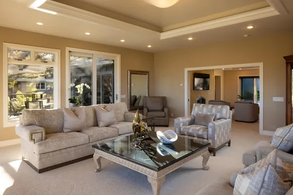 a living room with furniture and a large window