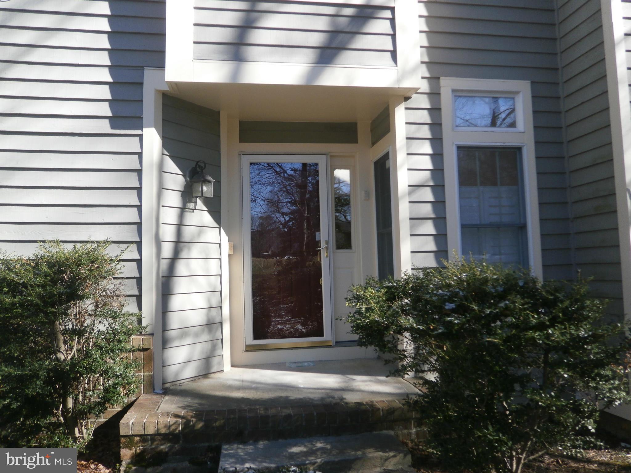 100 Spring Pl Way Annapolis, MD 21401 - Photo 2 of 15 a front view of a house with a yard
