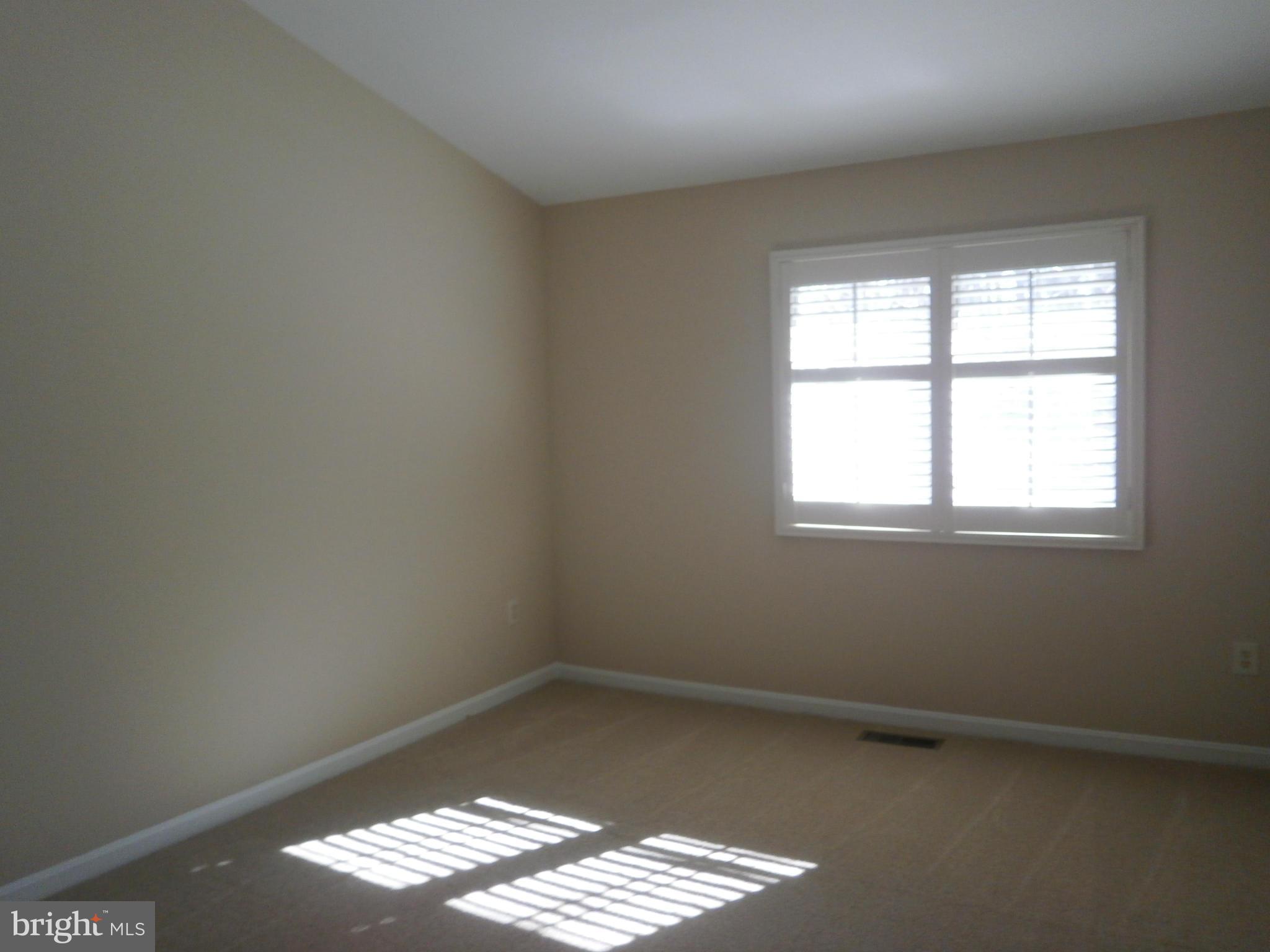 100 Spring Pl Way Annapolis, MD 21401 - Photo 8 of 15 an empty room with a window
