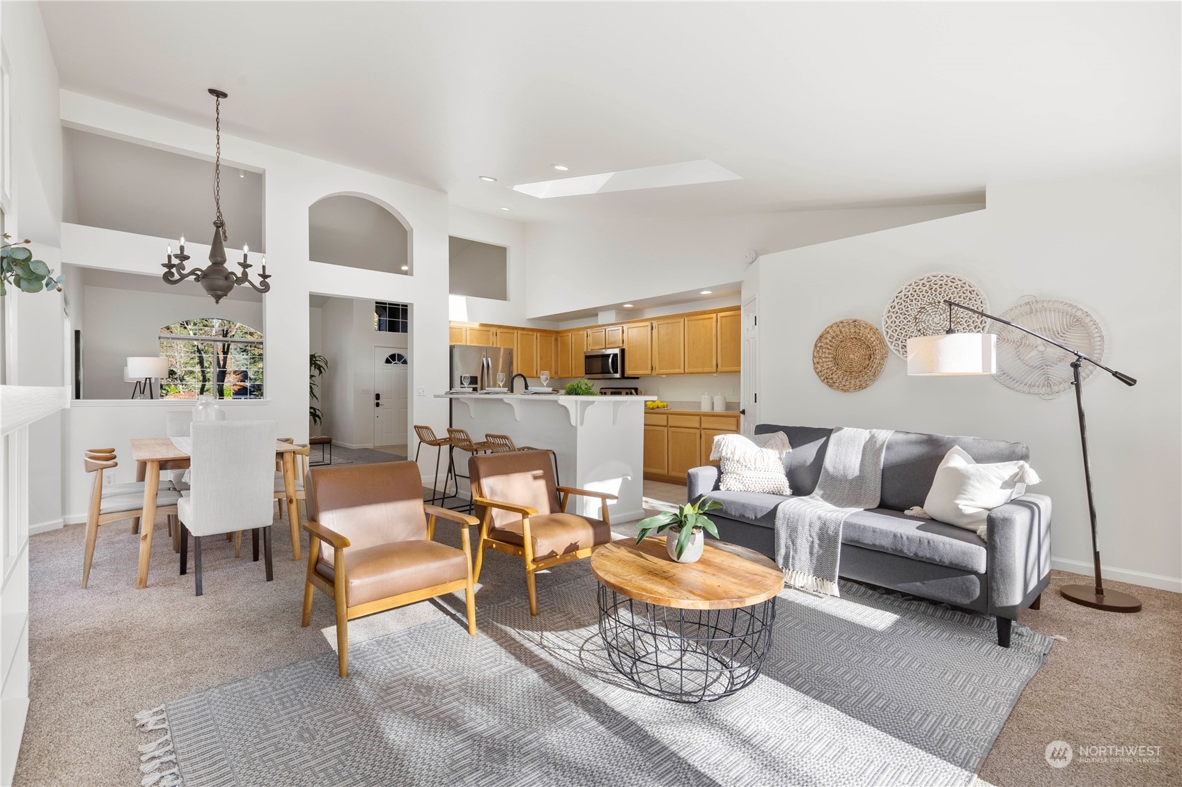 112 172nd Place Southeast Bothell, WA 98012 - Photo 13 of 30 a living room with furniture kitchen view and a chandelier