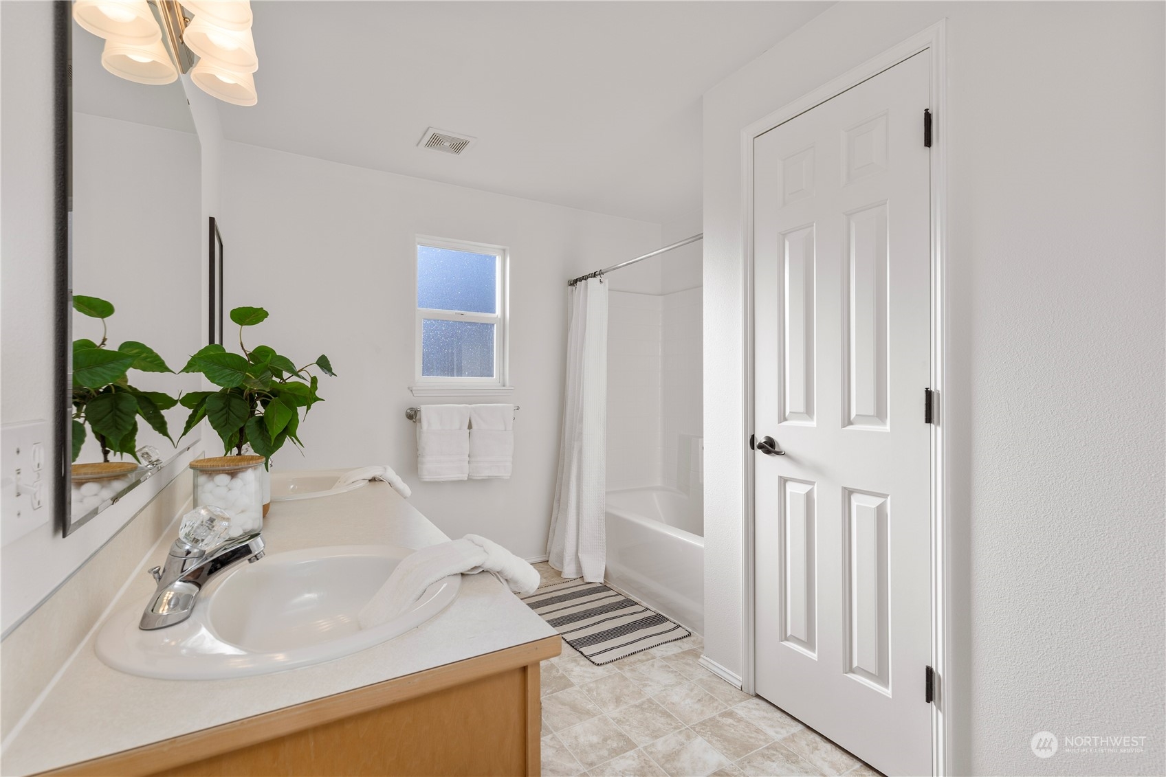 112 172nd Place Southeast Bothell, WA 98012 - Photo 18 of 30 a bathroom with a sink a vanity and a mirror