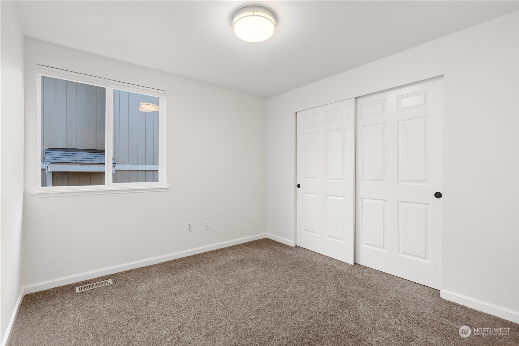112 172nd Place Southeast Bothell, WA 98012 - Photo 20 of 30 a view of an empty room with closet and a window