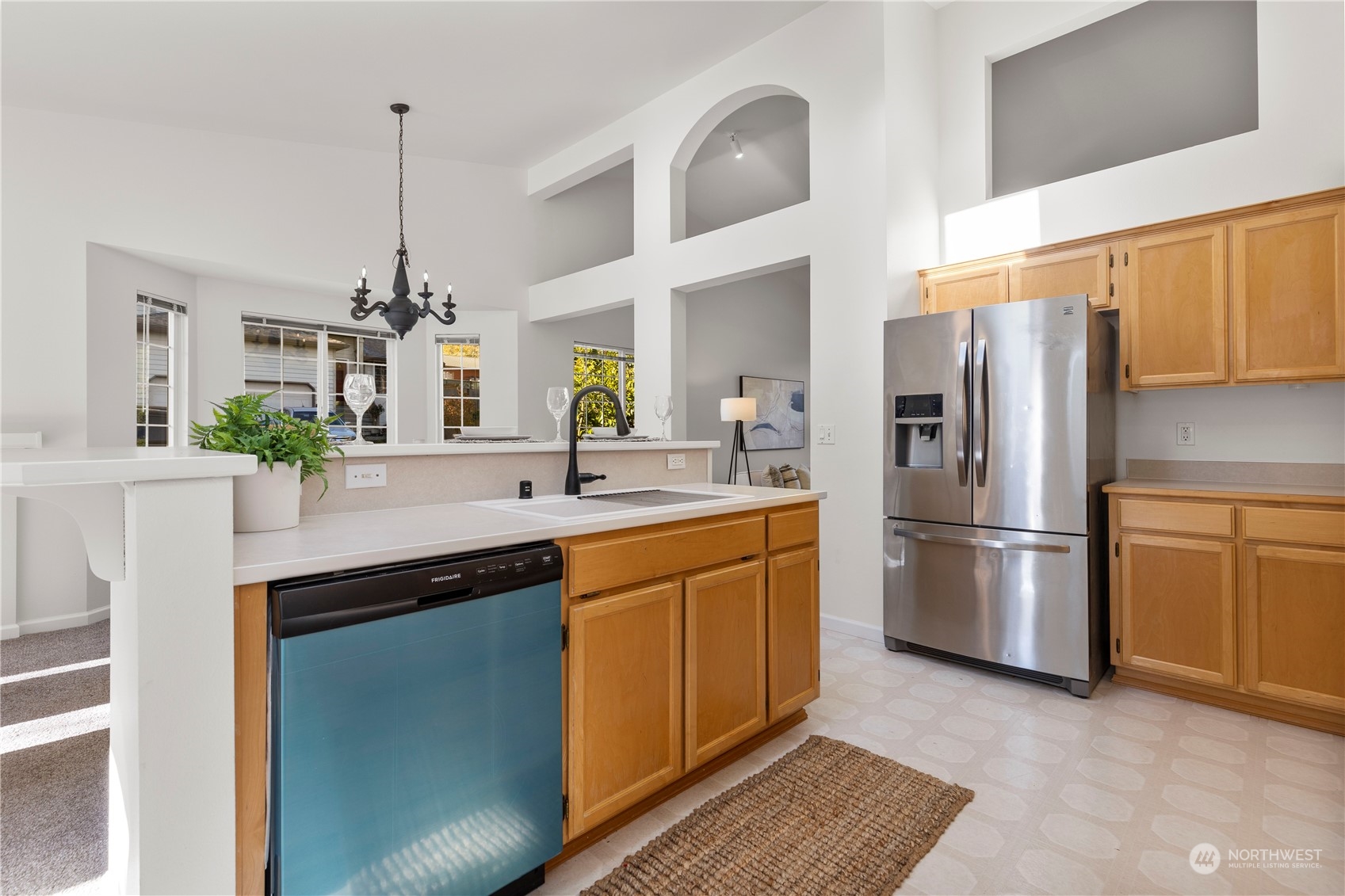 112 172nd Place Southeast Bothell, WA 98012 - Photo 10 of 30 a kitchen with stainless steel appliances a sink cabinets and a counter top space