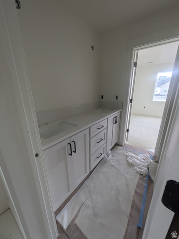 2771 West Aurora Avenue Mapleton, UT 84664 - Photo 28 of 39 Double vanity with integrated sinks, white cabinetry, and matte black hardware