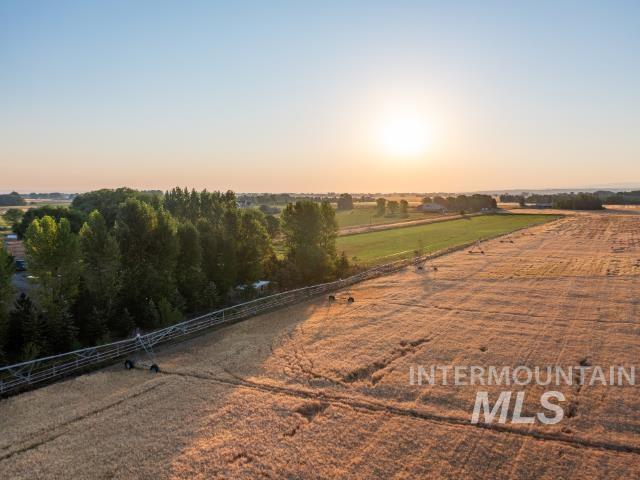 6891 West 2000 South Rexburg, ID 83440 - Photo 11 of 50 Yard at dusk featuring a view of countryside