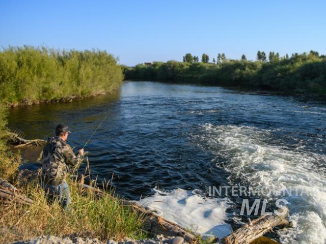 6891 West 2000 South Rexburg, ID 83440 - Photo 14 of 50 Water view with a heavily wooded area