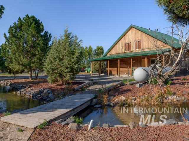 6891 West 2000 South Rexburg, ID 83440 - Photo 34 of 50 Dock area with a porch and a water view