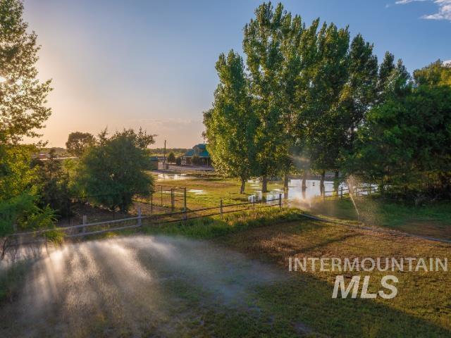 6891 West 2000 South Rexburg, ID 83440 - Photo 40 of 50 Yard at dusk with a view of rural / pastoral area