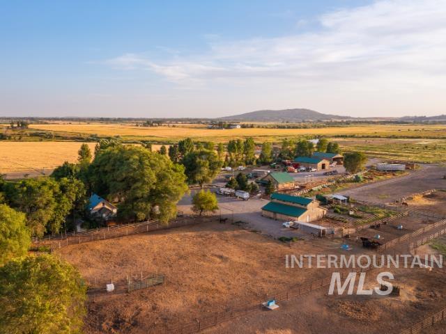 6891 West 2000 South Rexburg, ID 83440 - Photo 42 of 50 Aerial view of sparsely populated area featuring a mountainous background