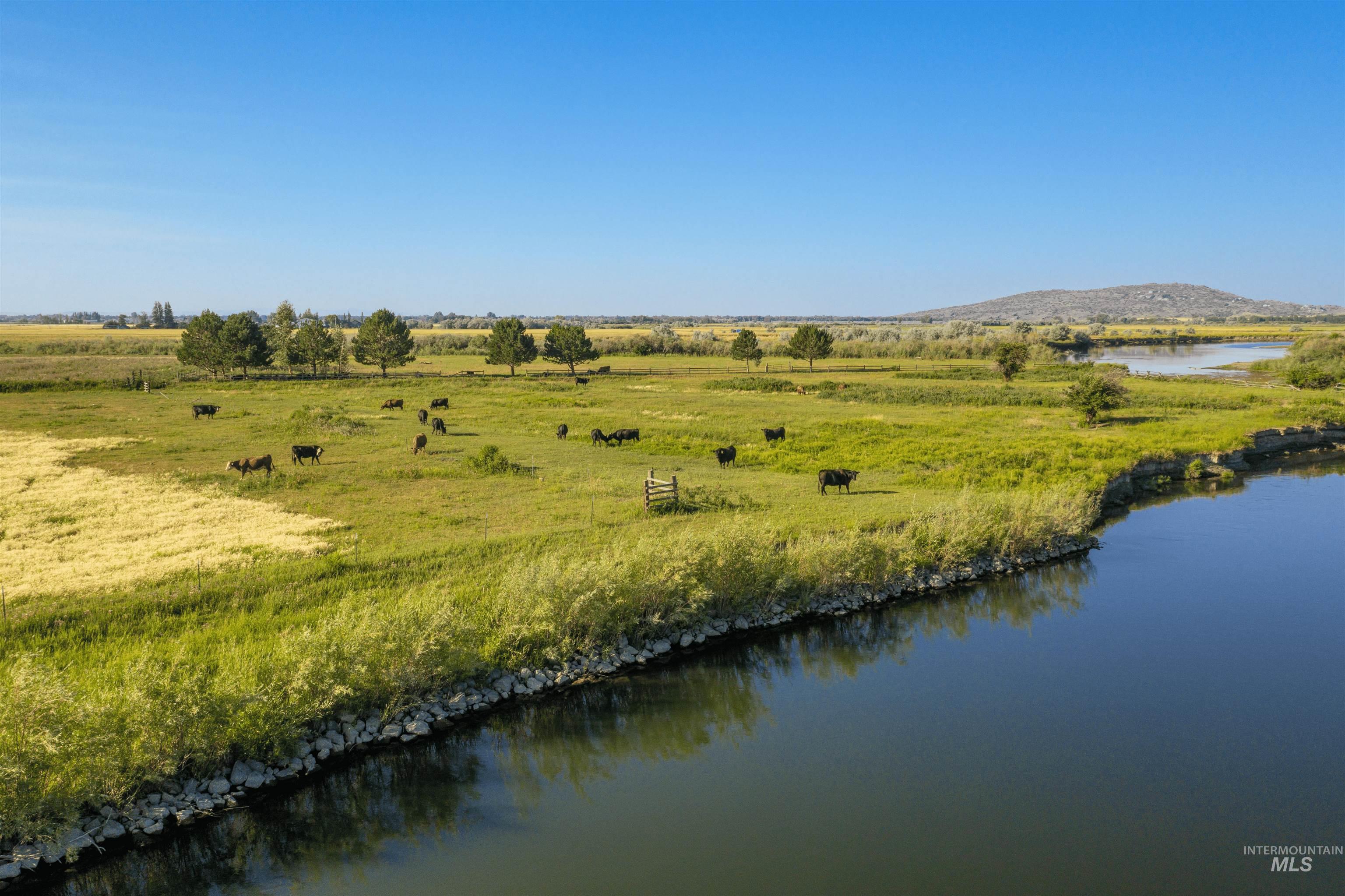 6891 West 2000 South Rexburg, ID 83440 - Photo 50 of 50 Water view featuring rural landscape and agricultural land