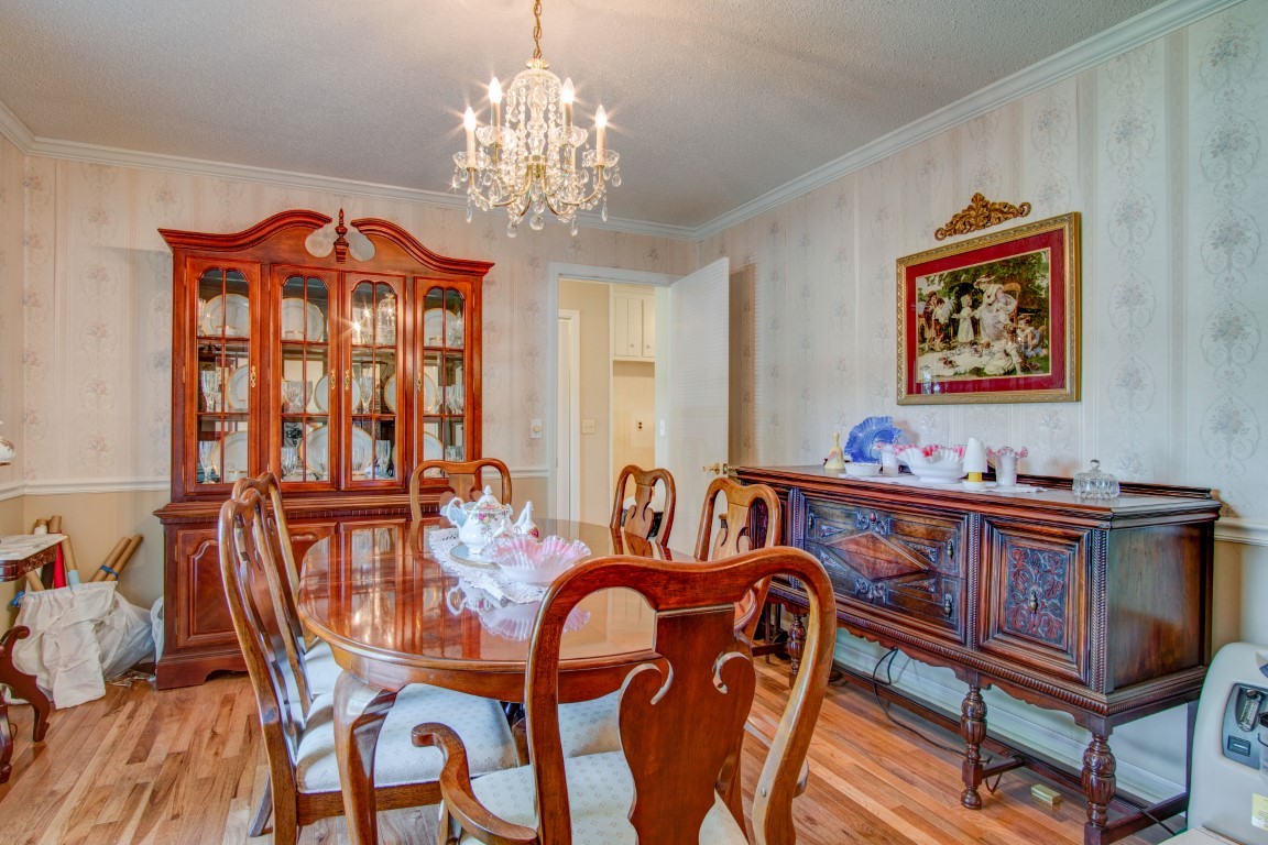 2407 Braxton Bragg Drive Murfreesboro, TN 37129 - Photo 12 of 23 a view of a dining room with furniture a chandelier and wooden floor