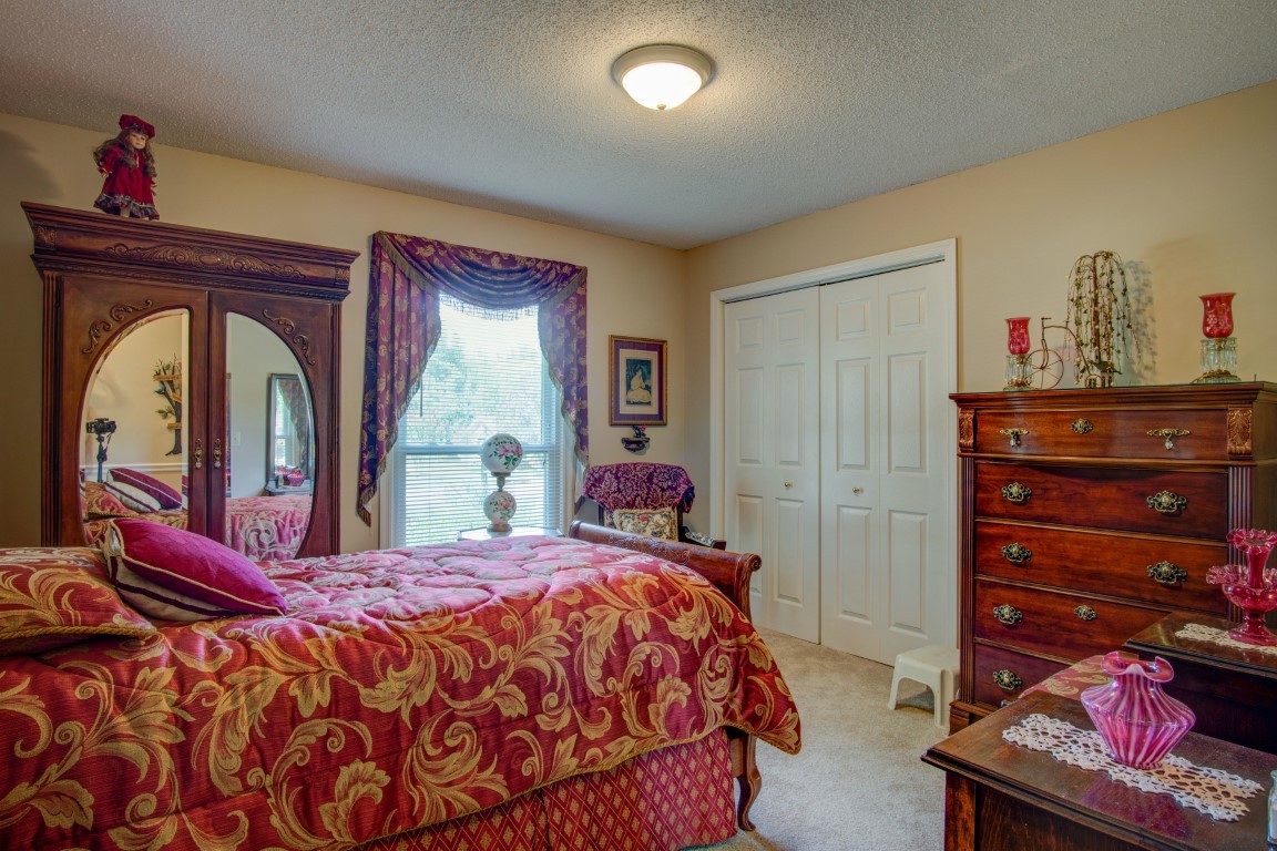 2407 Braxton Bragg Drive Murfreesboro, TN 37129 - Photo 13 of 23 a bedroom with a bed and a dresser