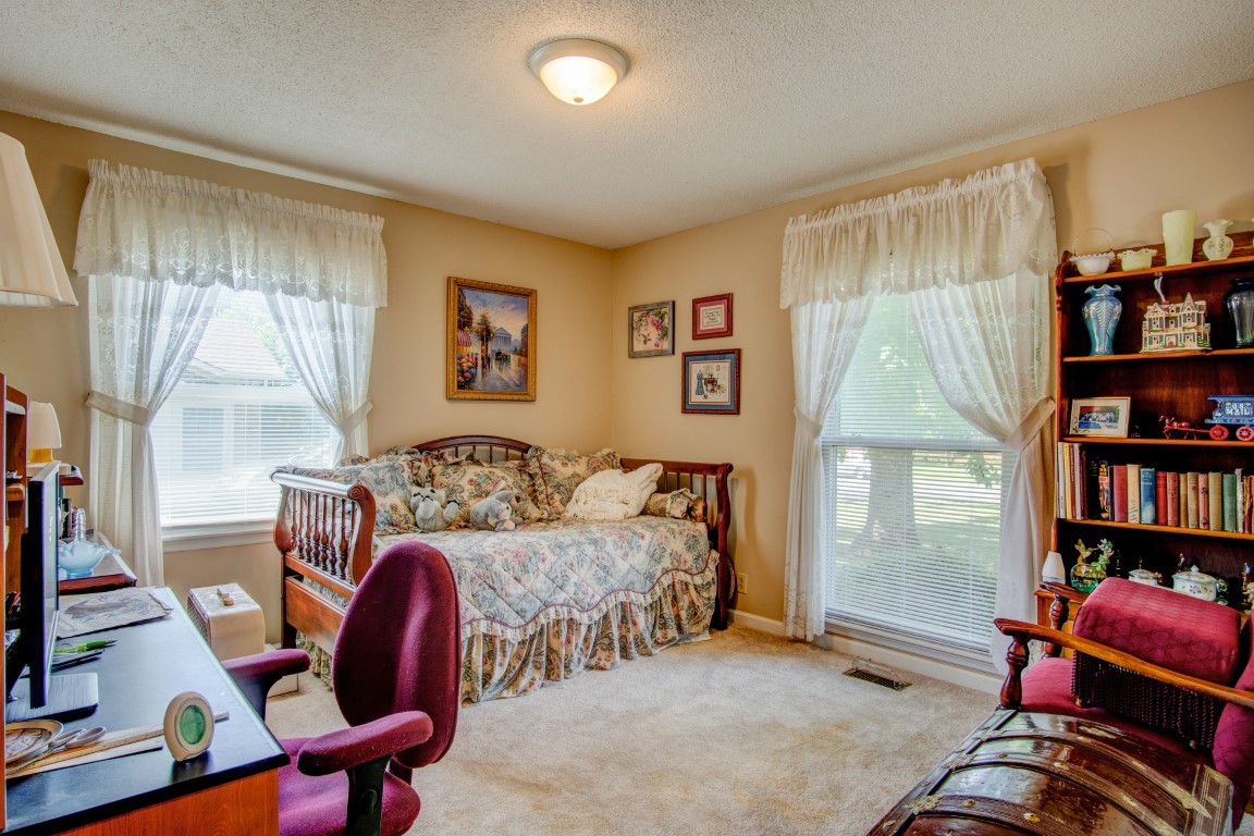 2407 Braxton Bragg Drive Murfreesboro, TN 37129 - Photo 14 of 23 a bedroom with furniture and a book shelf