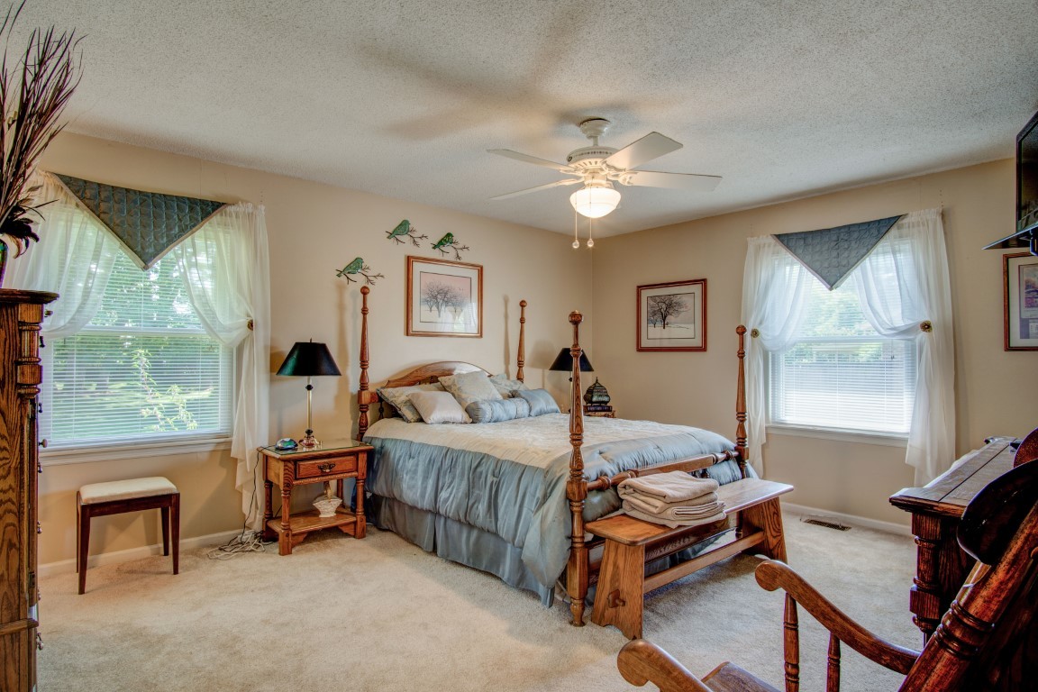 2407 Braxton Bragg Drive Murfreesboro, TN 37129 - Photo 15 of 23 a bedroom with a bed and a chandelier
