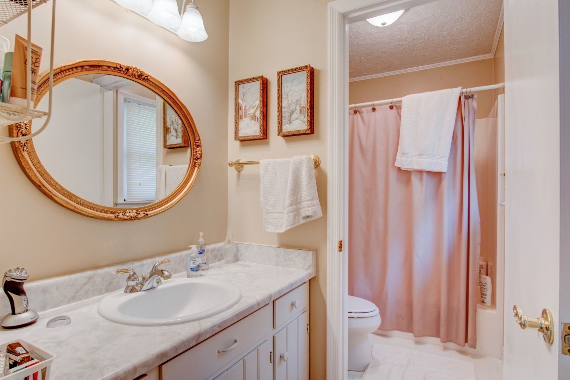 2407 Braxton Bragg Drive Murfreesboro, TN 37129 - Photo 17 of 23 a bathroom with a sink a toilet and a mirror