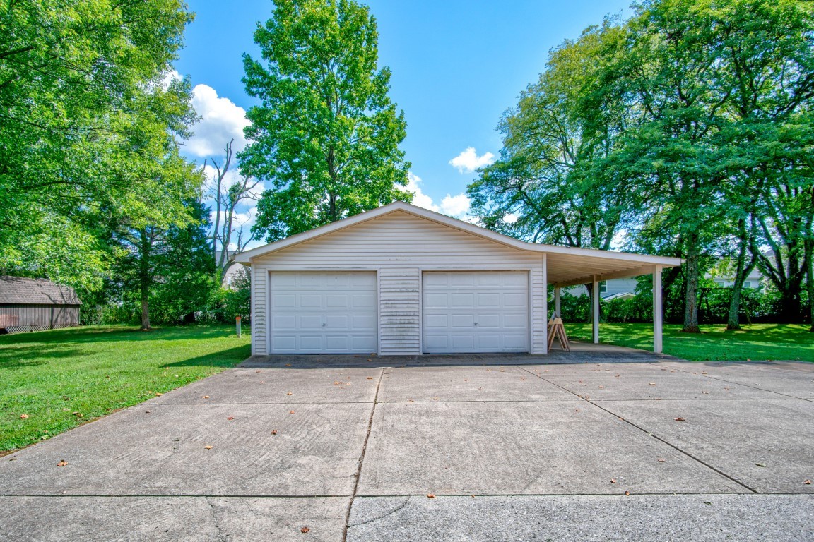 2407 Braxton Bragg Drive Murfreesboro, TN 37129 - Photo 21 of 23 a view of a house with a yard and large trees