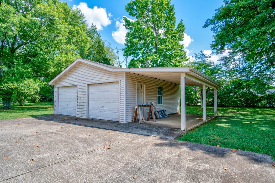 2407 Braxton Bragg Drive Murfreesboro, TN 37129 - Photo 22 of 23 a view of a house with a yard and large tree