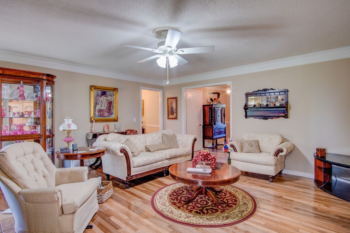 2407 Braxton Bragg Drive Murfreesboro, TN 37129 - Photo 8 of 23 a living room with furniture a rug and a chandelier