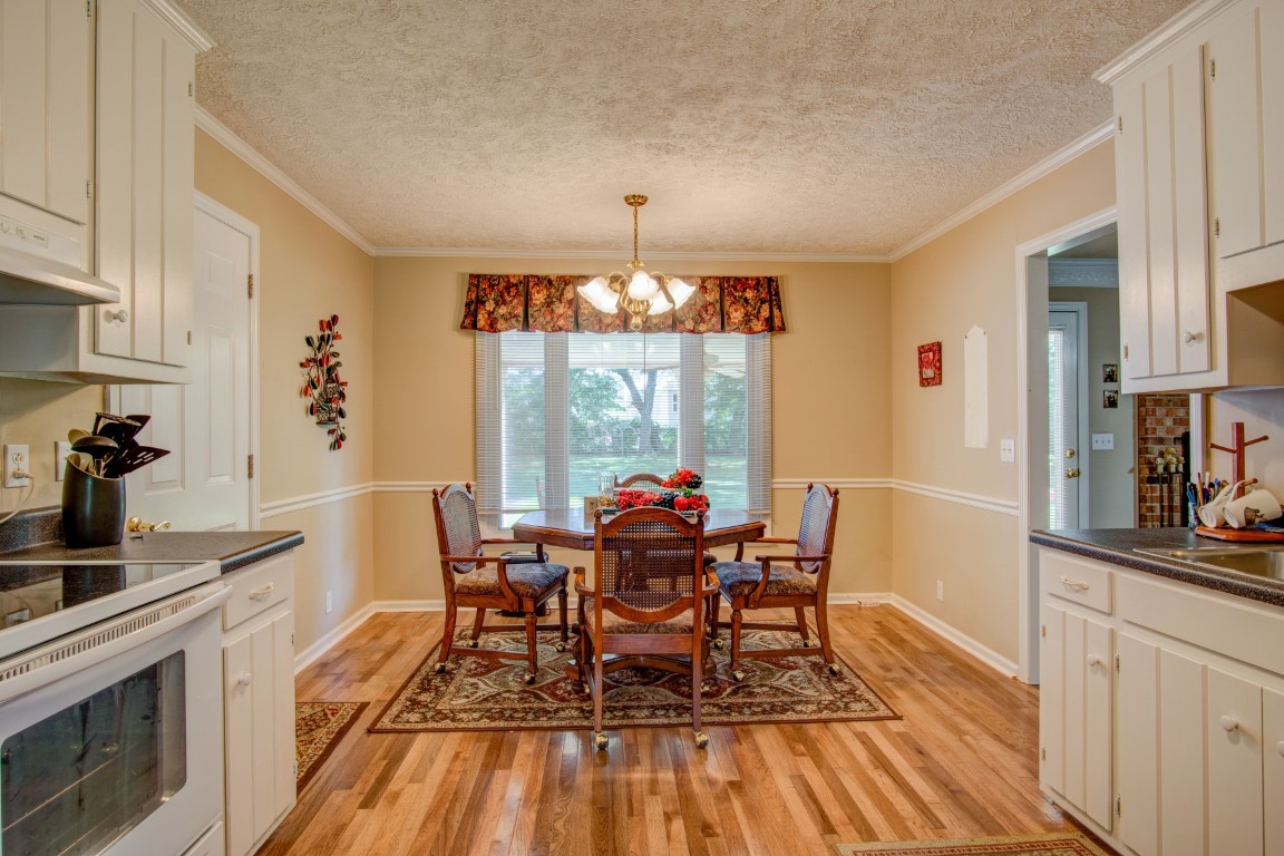 2407 Braxton Bragg Drive Murfreesboro, TN 37129 - Photo 10 of 23 a dining room with furniture and wooden floor