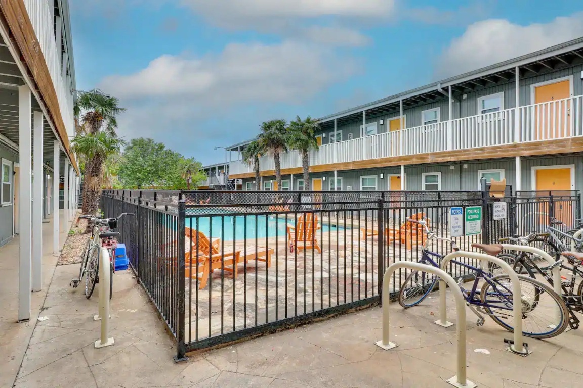 2401 Manor Road, Unit 129 Austin, TX 78722 - Photo 18 of 21 a view of a balcony with iron fence