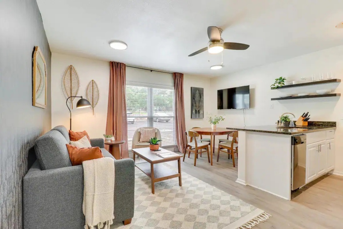 2401 Manor Road, Unit 129 Austin, TX 78722 - Photo 5 of 21 a living room with furniture and a large window