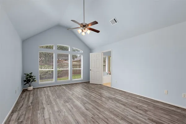 a kitchen with stainless steel appliances granite countertop a stove top oven a sink dishwasher and a microwave oven on the blue kitchen countertops