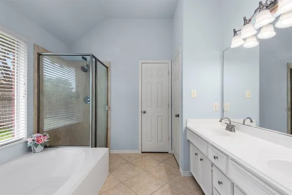 a white bath tub sitting next to a window