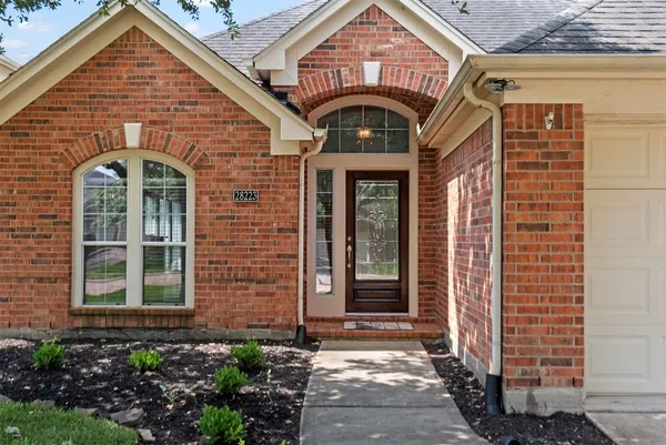 a front view of a house with glass windows