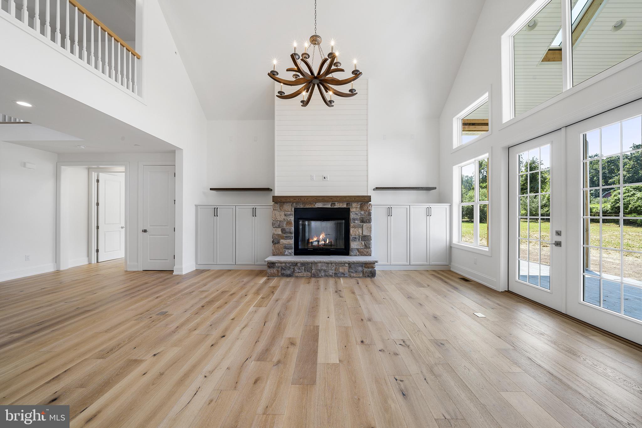 Family Room with fireplace and windows